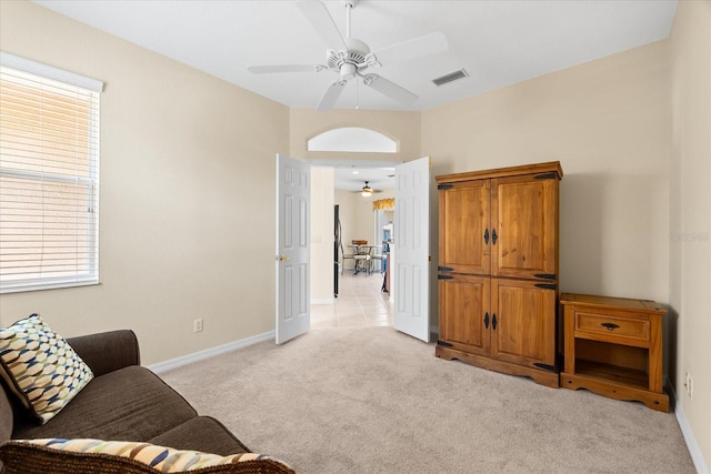 138 Tiziano Way N, Venice, FL 34275 - living area with a ceiling fan, light colored carpet, and baseboards