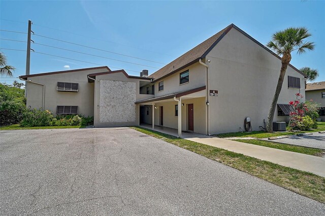 7211 Cloister Dr Unit 101, Sarasota, FL 34231 - view of property with stucco siding and central AC unit