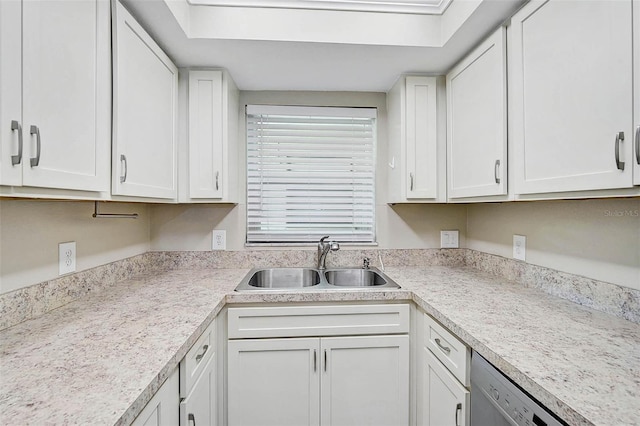 7211 Cloister Dr Unit 101, Sarasota, FL 34231 - kitchen with a sink, white cabinetry, light countertops, and stainless steel dishwasher