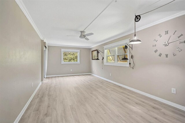 7211 Cloister Dr Unit 101, Sarasota, FL 34231 - spare room with a ceiling fan, baseboards, light wood-type flooring, and ornamental molding