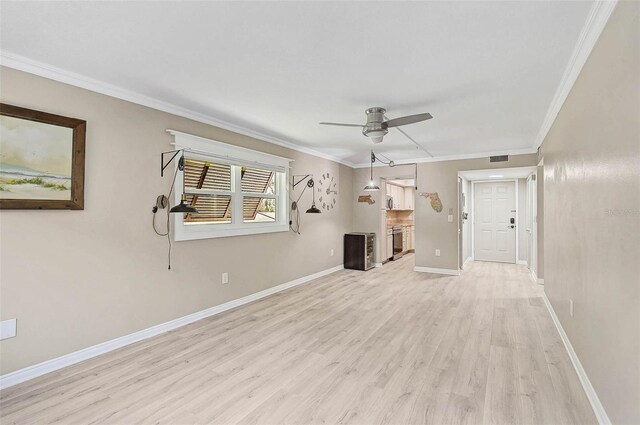 7211 Cloister Dr Unit 101, Sarasota, FL 34231 - unfurnished living room with ceiling fan, light wood finished floors, baseboards, and crown molding
