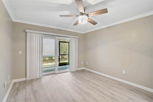 7211 Cloister Dr Unit 101, Sarasota, FL 34231 - spare room featuring wood finished floors, baseboards, crown molding, and a ceiling fan