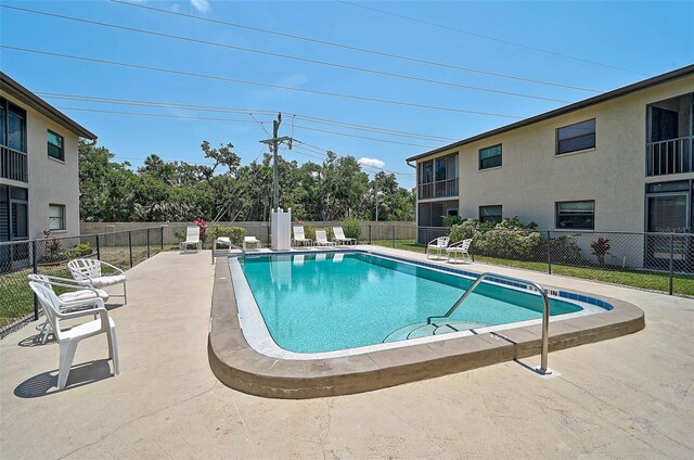 7211 Cloister Dr Unit 101, Sarasota, FL 34231 - community pool featuring a patio