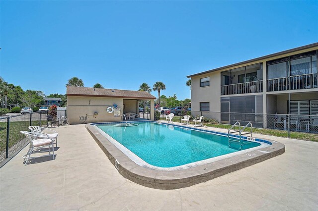 7211 Cloister Dr Unit 101, Sarasota, FL 34231 - community pool featuring a patio area