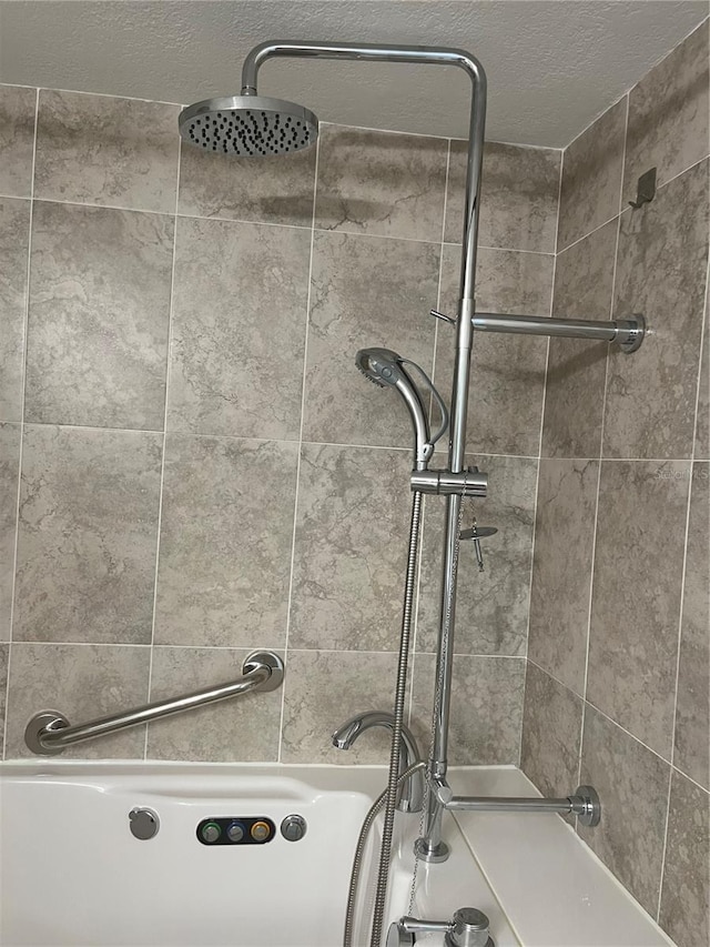 7211 Cloister Dr Unit 101, Sarasota, FL 34231 - bathroom with washtub / shower combination and a textured ceiling