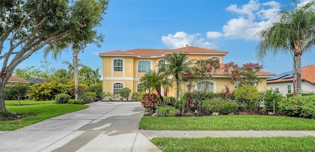 12520 Natureview Cir, Bradenton, FL 34212 - mediterranean / spanish-style home with stucco siding, driveway, and a front yard