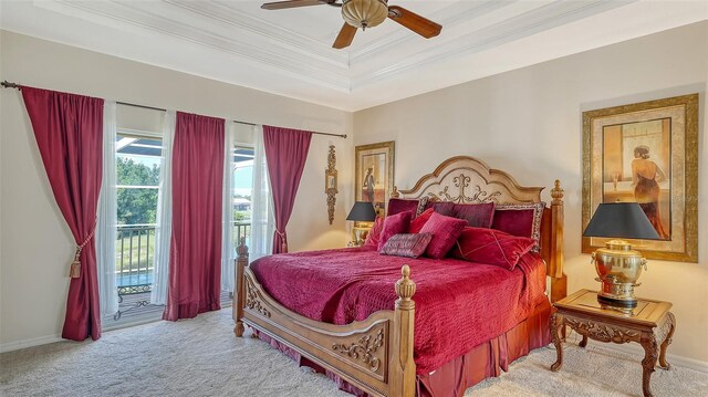12520 Natureview Cir, Bradenton, FL 34212 - bedroom featuring access to exterior, carpet flooring, ornamental molding, baseboards, and a tray ceiling