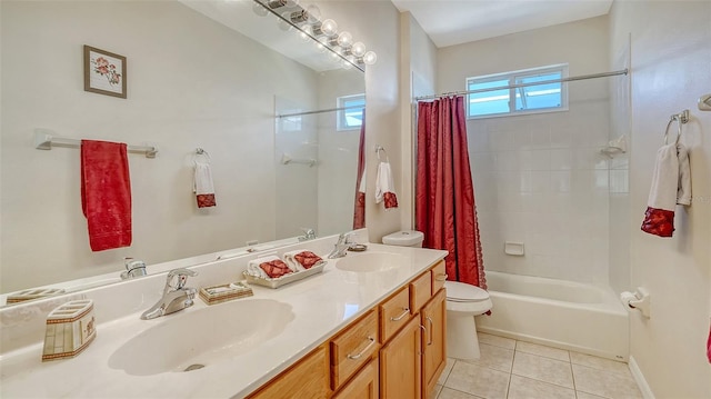 12520 Natureview Cir, Bradenton, FL 34212 - bathroom with toilet, double vanity, tile patterned floors, shower / tub combo with curtain, and baseboards