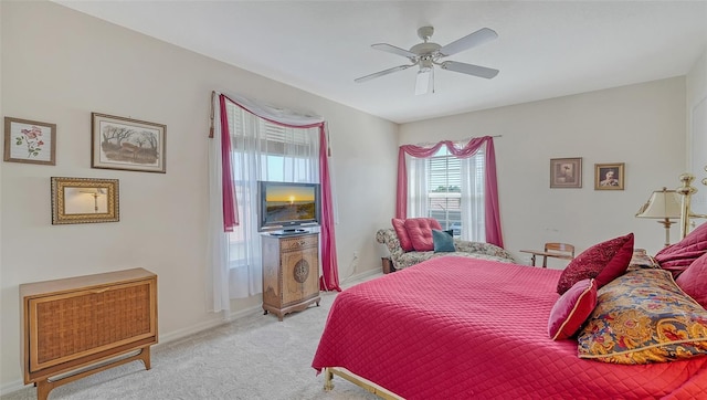 12520 Natureview Cir, Bradenton, FL 34212 - bedroom with light carpet, ceiling fan, and baseboards