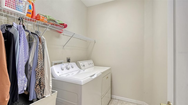 12520 Natureview Cir, Bradenton, FL 34212 - laundry room with washer and dryer, baseboards, and light tile patterned floors