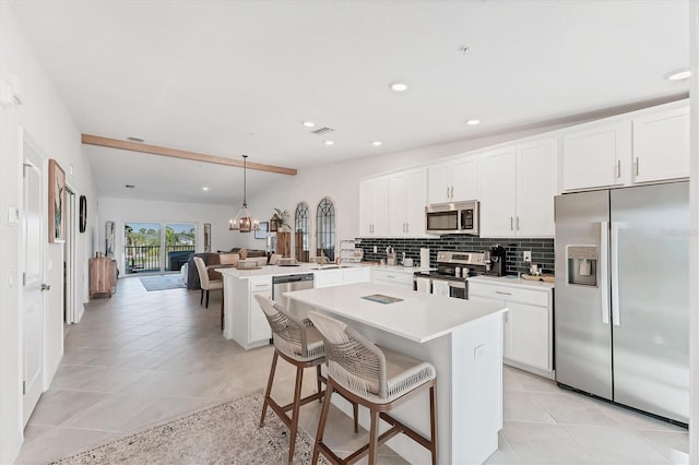 14257 Heritage Landing Blvd Unit 1122, Punta Gorda, FL 33955 - kitchen featuring appliances with stainless steel finishes, a peninsula, decorative backsplash, recessed lighting, and light countertops