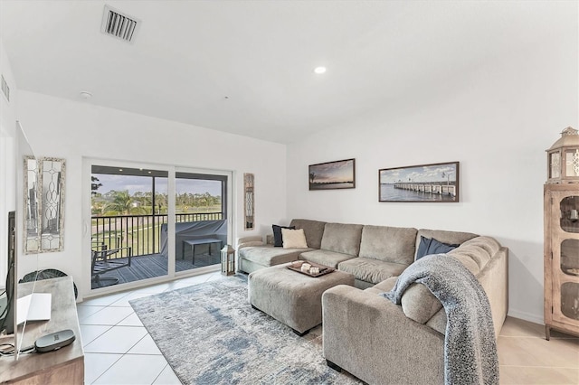 14257 Heritage Landing Blvd Unit 1122, Punta Gorda, FL 33955 - living room with light tile patterned floors and lofted ceiling