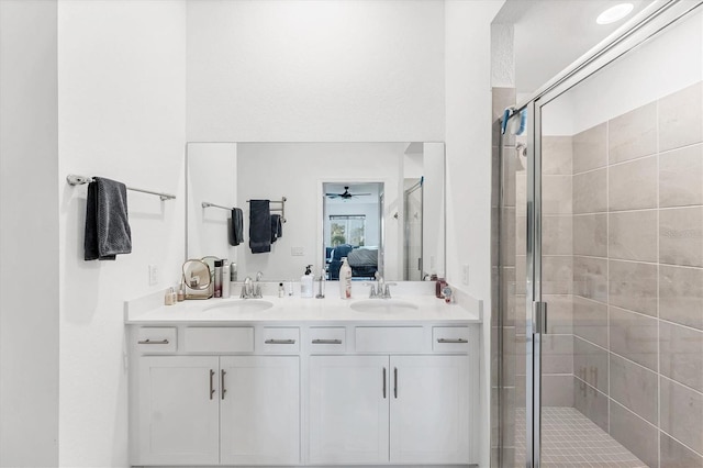 14257 Heritage Landing Blvd Unit 1122, Punta Gorda, FL 33955 - ensuite bathroom with a stall shower, double vanity, and a ceiling fan