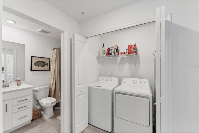 14257 Heritage Landing Blvd Unit 1122, Punta Gorda, FL 33955 - washroom with washer and dryer and light tile patterned flooring