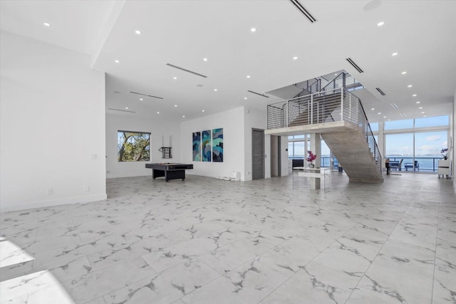 4035 Bay Shore Rd, Sarasota, FL 34234 - common area with recessed lighting, a towering ceiling, and a wall of windows