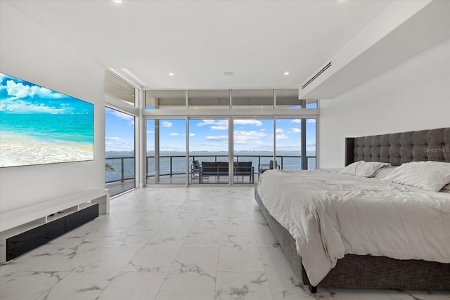 4035 Bay Shore Rd, Sarasota, FL 34234 - bedroom featuring access to exterior, a water view, marble look tiles, expansive windows, and recessed lighting