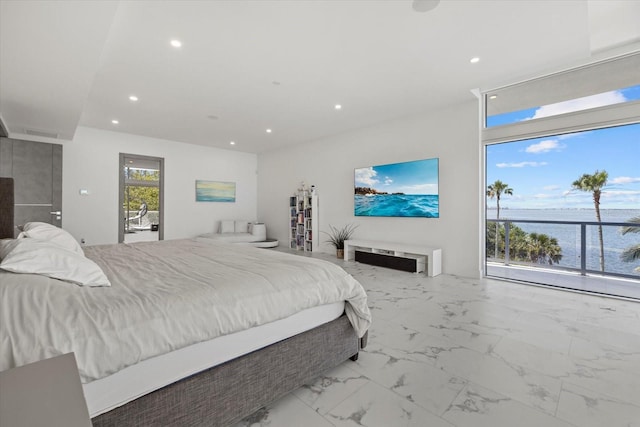 4035 Bay Shore Rd, Sarasota, FL 34234 - bedroom with recessed lighting, marble look tiles, and a water view