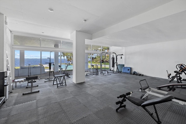 4035 Bay Shore Rd, Sarasota, FL 34234 - exercise room featuring a water view and carpet floors