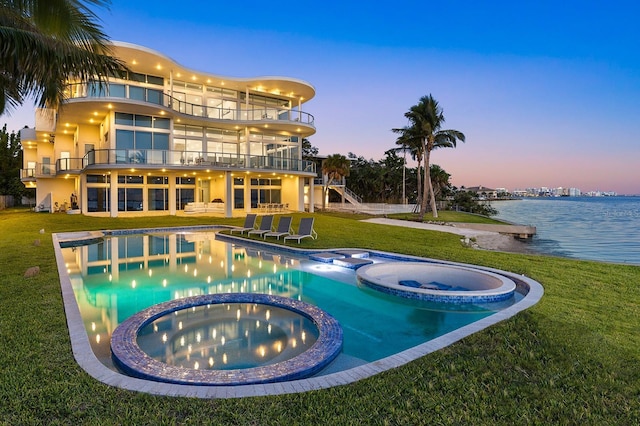 4035 Bay Shore Rd, Sarasota, FL 34234 - view of pool with a pool with connected hot tub, a lawn, a water view, a patio, and stairway