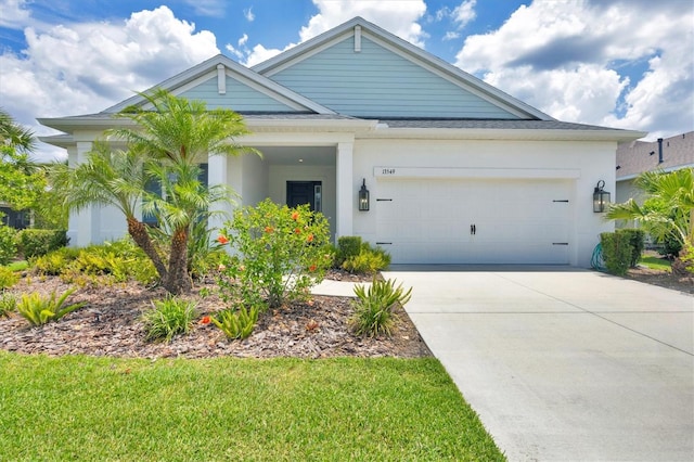 13549 Old Creek Ct, Parrish, FL 34219 - view of front of house with concrete driveway and a garage