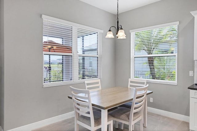 13549 Old Creek Ct, Parrish, FL 34219 - dining area featuring baseboards and a chandelier