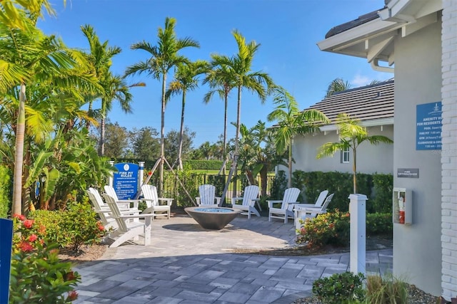 13549 Old Creek Ct, Parrish, FL 34219 - view of patio / terrace featuring a fire pit