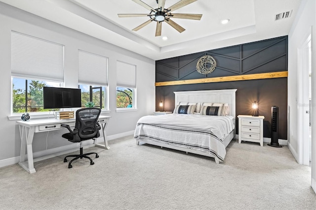 17547 Cantarina Cv, Bradenton, FL 34211 - carpeted bedroom with a raised ceiling, baseboards, multiple windows, recessed lighting, and a desk