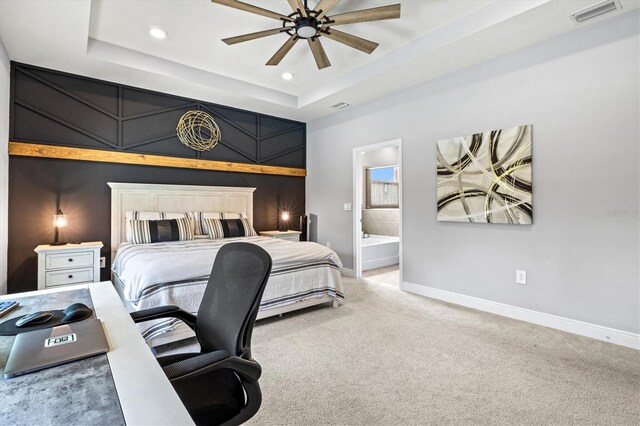 17547 Cantarina Cv, Bradenton, FL 34211 - bedroom with a raised ceiling, carpet flooring, baseboards, recessed lighting, and ensuite bathroom
