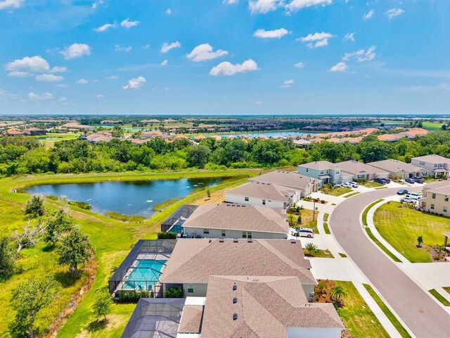 17547 Cantarina Cv, Bradenton, FL 34211 - aerial view of residential area with a nearby body of water and a tree filled landscape