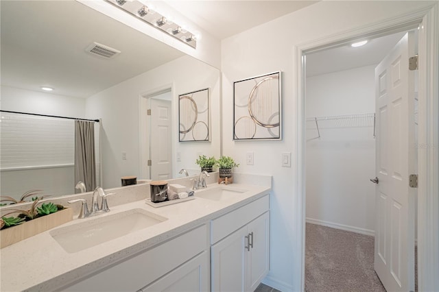 2081 Basin St, Port Charlotte, FL 33952 - bathroom featuring double vanity, a spacious closet, curtained shower, and recessed lighting