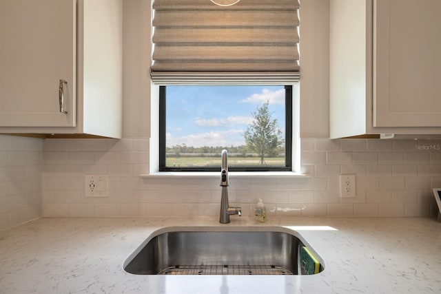 6239 Baywood Ct, Bradenton, FL 34211 - kitchen featuring tasteful backsplash, white cabinets, and light stone counters