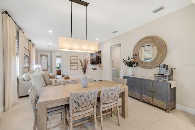 6239 Baywood Ct, Bradenton, FL 34211 - dining room with light tile patterned floors, washer / dryer, and recessed lighting