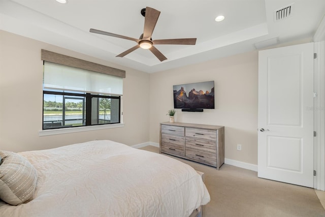 6239 Baywood Ct, Bradenton, FL 34211 - bedroom featuring light carpet, a tray ceiling, recessed lighting, and ceiling fan