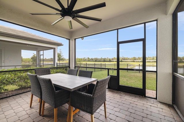 6239 Baywood Ct, Bradenton, FL 34211 - sunroom / solarium featuring a water view, ceiling fan, and outdoor dining space
