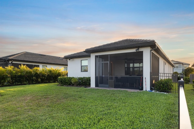 6239 Baywood Ct, Bradenton, FL 34211 - rear view of house featuring a sunroom, stucco siding, and a tiled roof