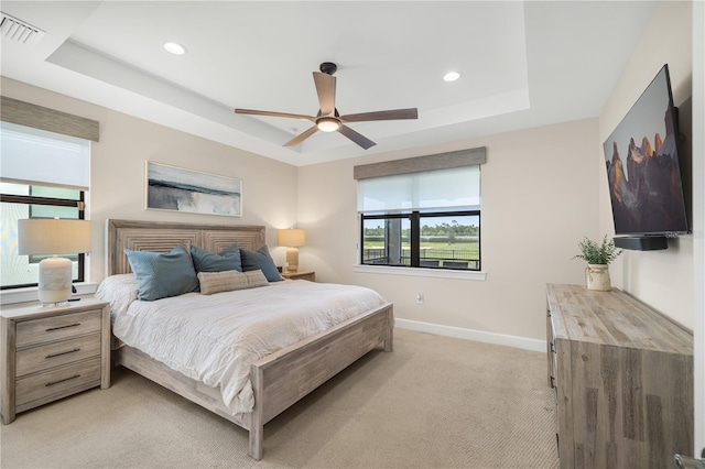 6239 Baywood Ct, Bradenton, FL 34211 - bedroom with a tray ceiling, light carpet, recessed lighting, and a ceiling fan