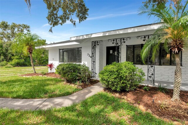 326 25th St W, Bradenton, FL 34205 - view of front of home with a front yard
