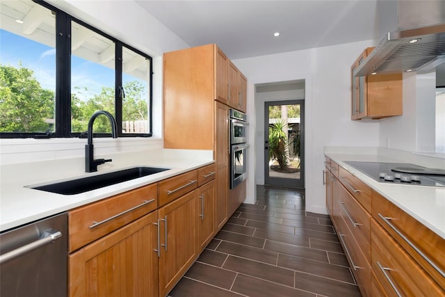 326 25th St W, Bradenton, FL 34205 - kitchen featuring a sink, appliances with stainless steel finishes, wall chimney exhaust hood, light countertops, and recessed lighting