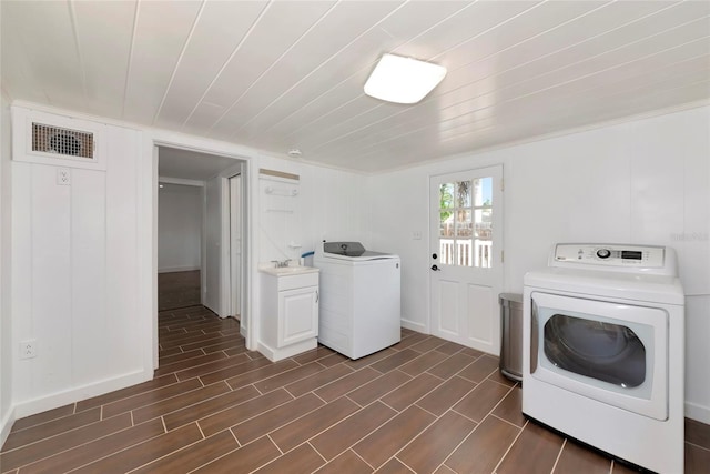 326 25th St W, Bradenton, FL 34205 - laundry room with washer and dryer and cabinet space