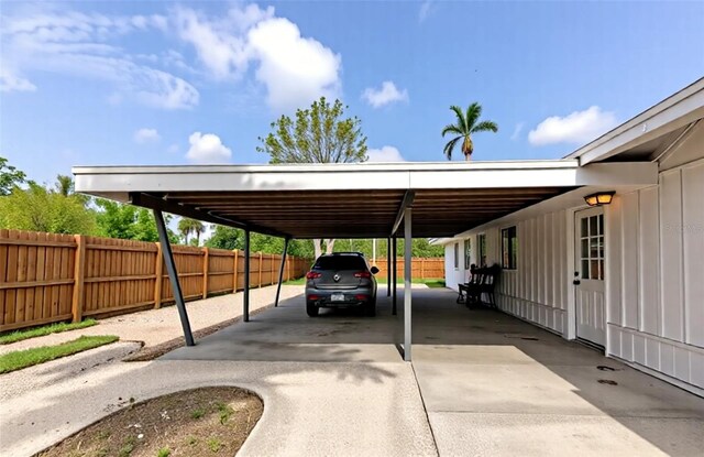 326 25th St W, Bradenton, FL 34205 - view of vehicle parking with an attached carport and driveway