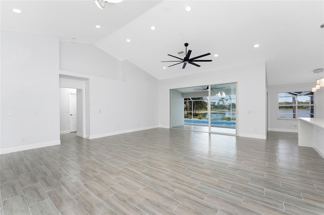 10055 Franklin Dr, Englewood, FL 34224 - unfurnished living room featuring ceiling fan, recessed lighting, baseboards, high vaulted ceiling, and light wood-type flooring
