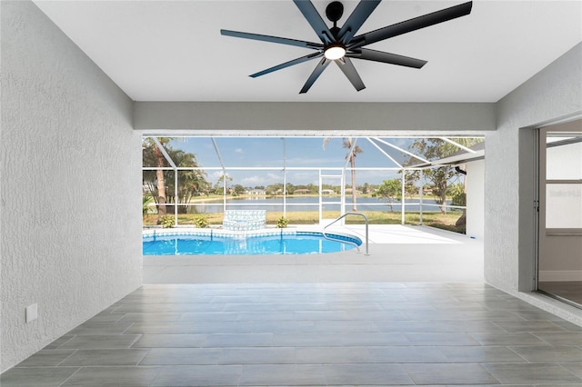 10055 Franklin Dr, Englewood, FL 34224 - outdoor pool featuring ceiling fan, a patio, a water view, and glass enclosure