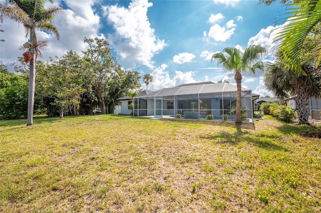10055 Franklin Dr, Englewood, FL 34224 - view of grassy yard with glass enclosure