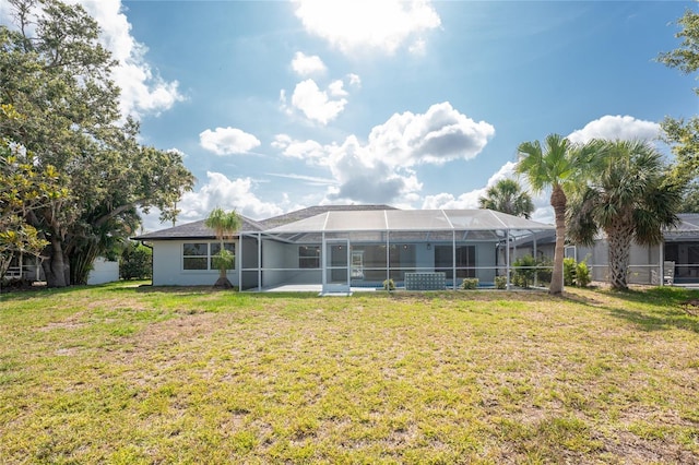 10055 Franklin Dr, Englewood, FL 34224 - rear view of property with a yard