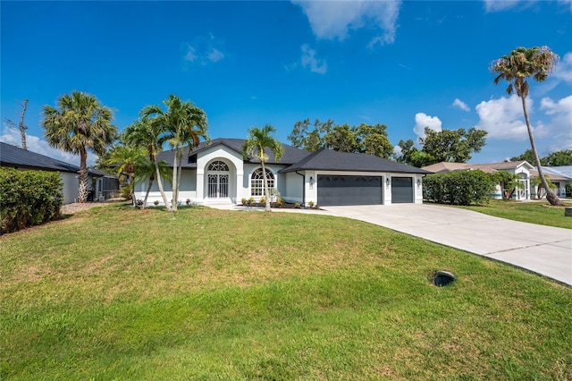 10055 Franklin Dr, Englewood, FL 34224 - ranch-style home featuring a garage, driveway, a front lawn, and stucco siding
