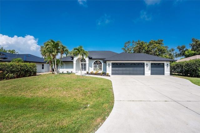 10055 Franklin Dr, Englewood, FL 34224 - ranch-style home with a garage, concrete driveway, a front yard, and stucco siding