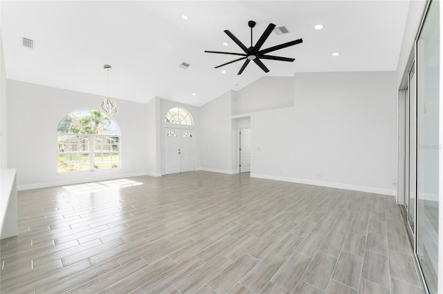 10055 Franklin Dr, Englewood, FL 34224 - unfurnished living room featuring high vaulted ceiling, recessed lighting, a ceiling fan, baseboards, and light wood-type flooring