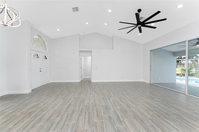 10055 Franklin Dr, Englewood, FL 34224 - unfurnished living room featuring a chandelier, light wood-type flooring, ceiling fan, baseboards, and recessed lighting