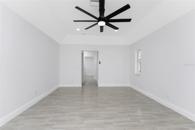 10055 Franklin Dr, Englewood, FL 34224 - unfurnished room with a ceiling fan, recessed lighting, a raised ceiling, baseboards, and light wood-type flooring