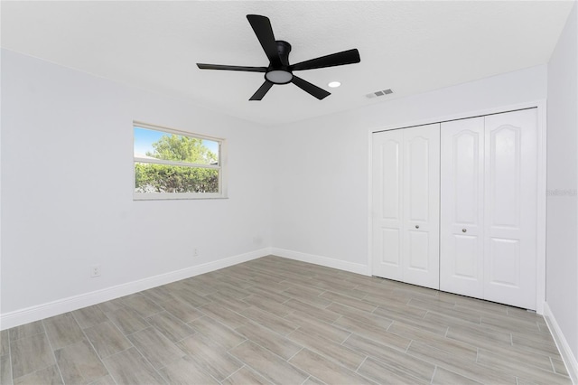 10055 Franklin Dr, Englewood, FL 34224 - unfurnished bedroom with baseboards, a closet, light wood-style flooring, a ceiling fan, and recessed lighting